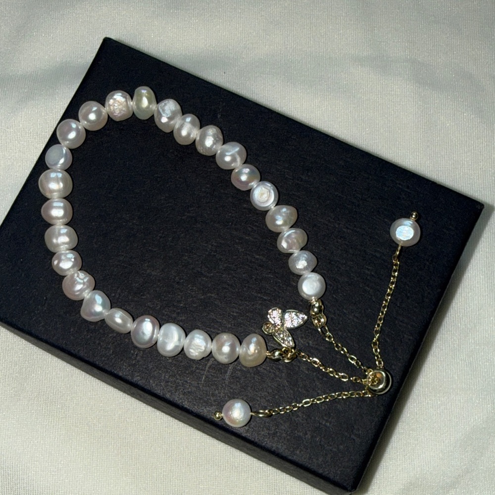 Elegant Pearl Bracelet with Butterfly Charm